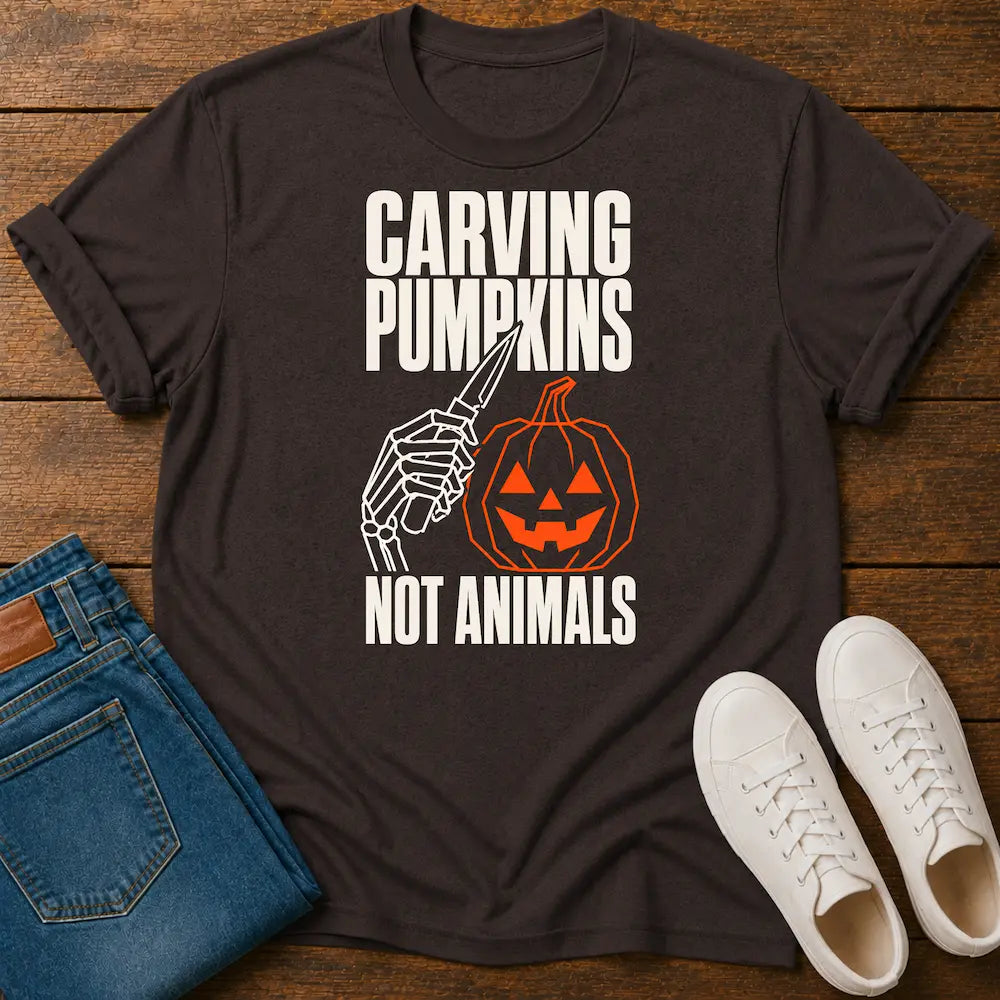 Brown graphic tee with pumpkin graphic and text 'carving pumpkins not animals'
