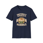 Navy graphic t-shirt with an image of a tub of hummus and text 'emotionally supported by hummus' on a wooden board with jeans and sneakers