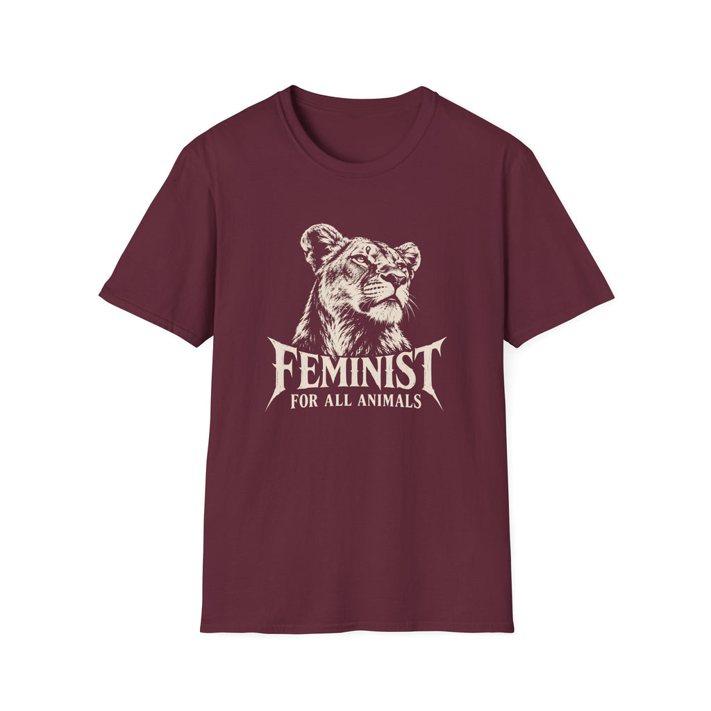 A maroon short-sleeve crewneck t-shirt featuring a cream graphic of a lioness head with the text 'FEMINIST FOR ALL ANIMALS' printed on the front, displayed against a solid white background.