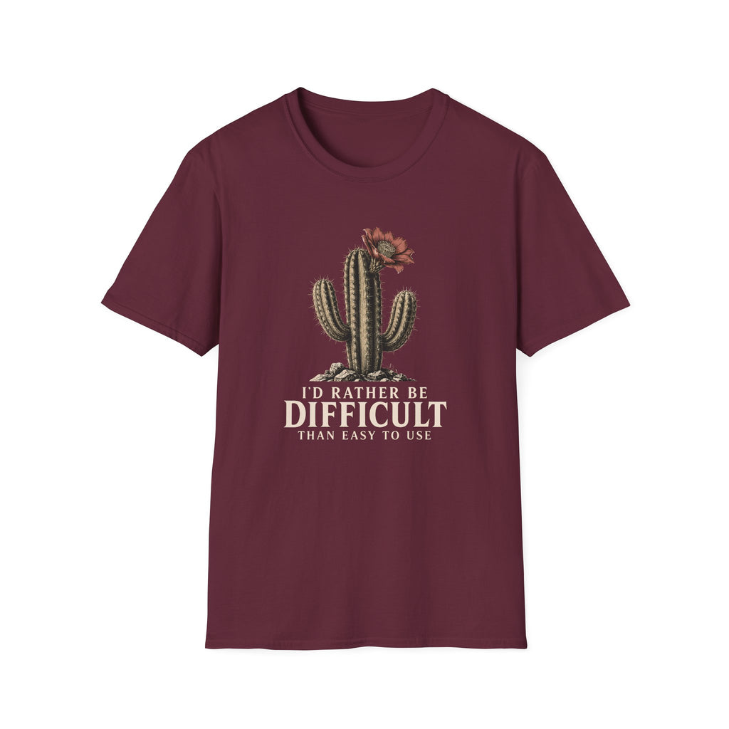 A maroon short-sleeve crewneck t-shirt featuring a graphic of a cactus with a flower and the text 'I'D RATHER BE DIFFICULT THAN EASY TO USE' printed on the front, displayed against a solid white background.