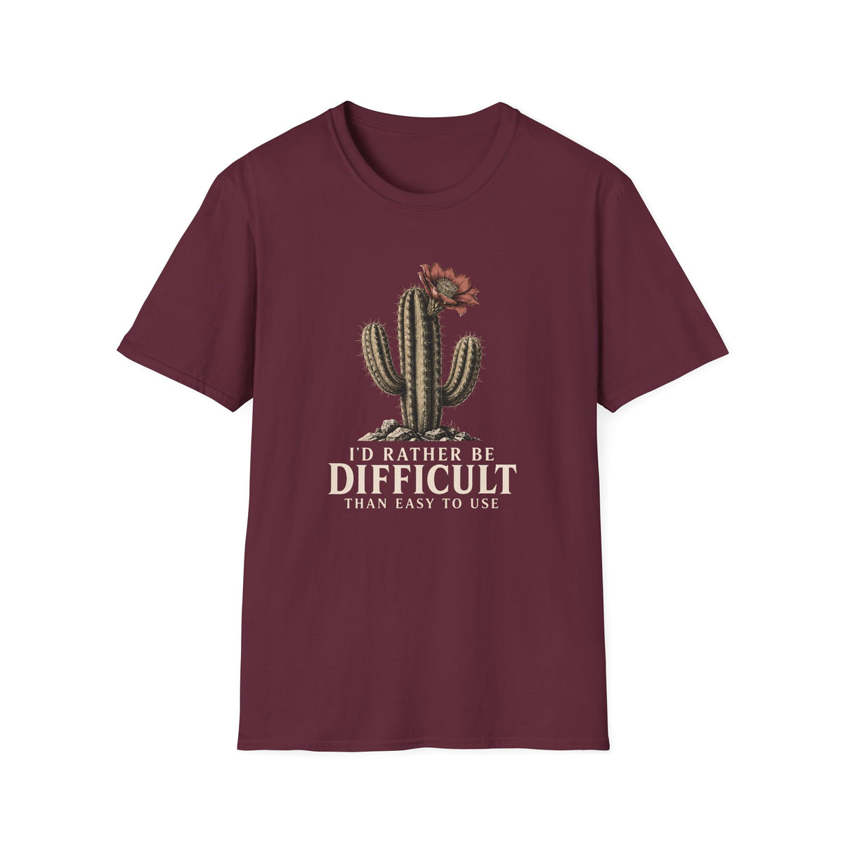 A maroon short-sleeve crewneck t-shirt featuring a graphic of a cactus with a flower and the text 'I'D RATHER BE DIFFICULT THAN EASY TO USE' printed on the front, displayed against a solid white background.