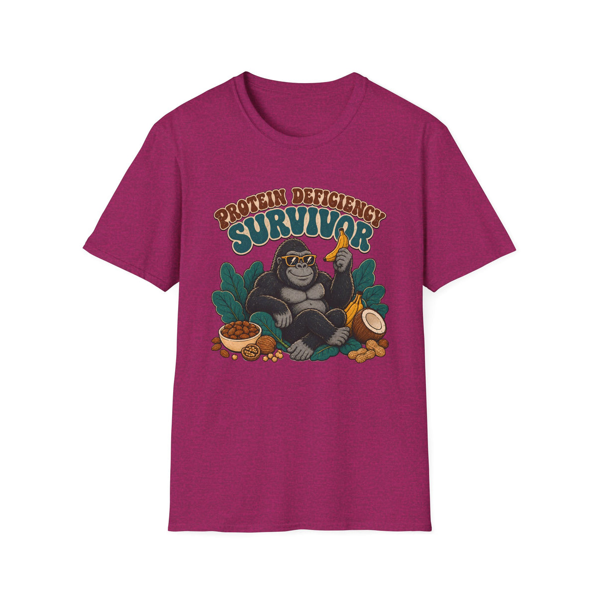 A heather magenta short-sleeve t-shirt with a graphic of a gorilla wearing sunglasses and holding a banana, surrounded by text that reads 'PROTEIN DEFICITY SURVIVOR' and tropical elements like leaves, a bowl of beans, and a coconut.