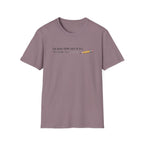 A dusty purple short-sleeve crewneck t-shirt with a graphic on the chest that reads 'TOO WEAK FROM LACK OF B12 TO FINISH THIS SlOGAN' next to a small yellow pencil illustration, displayed on a clean white background.