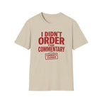 A beige crewneck t-shirt with a bold red graphic print on the front that reads 'I DIDN'T ORDER THE COMMENTARY' and a 'COMMENTS CLOSED' stamp graphic below it, shown against a plain white background.