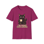 Pink t-shirt of a Black cat holding a coffee mug and raising its middle finger above the words “I’m Done Explaining” in bold cream vintage lettering.