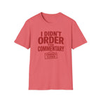 A coral pink short-sleeve t-shirt with a dark red graphic text print reading 'I DIDN'T ORDER THE COMMENTARY' and a 'COMMENTS CLOSED' stamp graphic, shown on a plain white background.