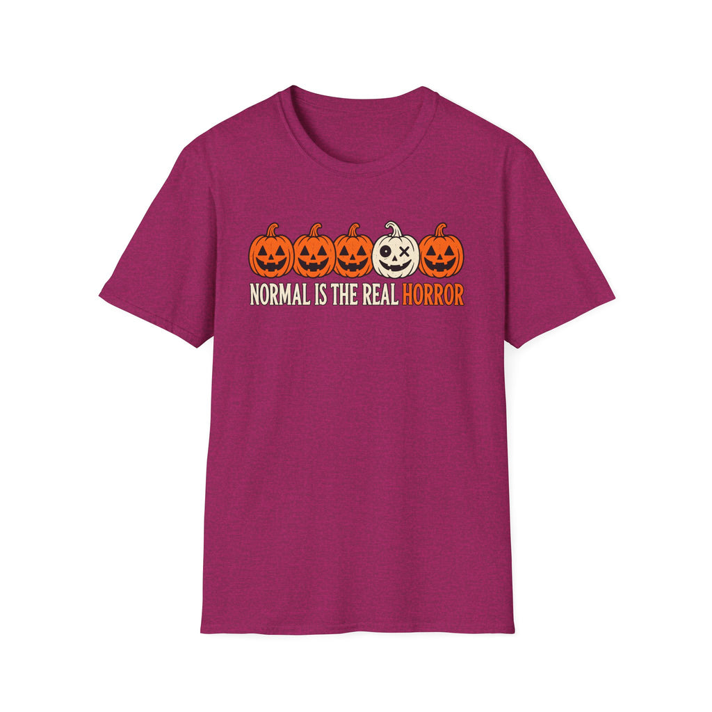 Pink Graphic T-shirt design featuring five jack-o’-lanterns, with one white mismatched pumpkin standing out from four orange pumpkins, above the words “Normal Is the Real Horror.”