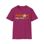 Pink Graphic T-shirt design featuring five jack-o’-lanterns, with one white mismatched pumpkin standing out from four orange pumpkins, above the words “Normal Is the Real Horror.”