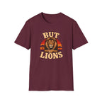 A maroon short-sleeve crewneck t-shirt featuring a retro-style graphic of a lion's face in front of a sunset, with the words 'BUT LIONS' printed in a distressed beige font.