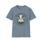 A stone blue short-sleeve crewneck t-shirt featuring a circular graphic print of a black and white cow with a bell and the text 'FOR THE RIGHTFUL OWNER NOT YOUR BOTTLE' and 'RESERVED'.