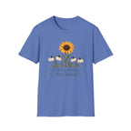 Iris blue graphic T-shirt featuring a bright yellow sunflower above four drooping cream flowers with I Wasn't Made for Mass Approval in cursive text.