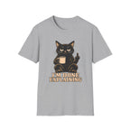 Grey t-shirt of a Black cat holding a coffee mug and raising its middle finger above the words “I’m Done Explaining” in bold cream vintage lettering.