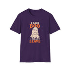 Purple graphic T-shirt design featuring an unimpressed cream ghost with crossed arms and the words “I Said Boo I Meant Leave” in cream and orange lettering.