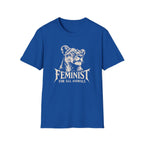 A royal blue short-sleeve crewneck t-shirt featuring a white graphic print of a lioness head and the text 'FEMINIST FOR ALL ANIMALS' on the chest, displayed against a solid white background.