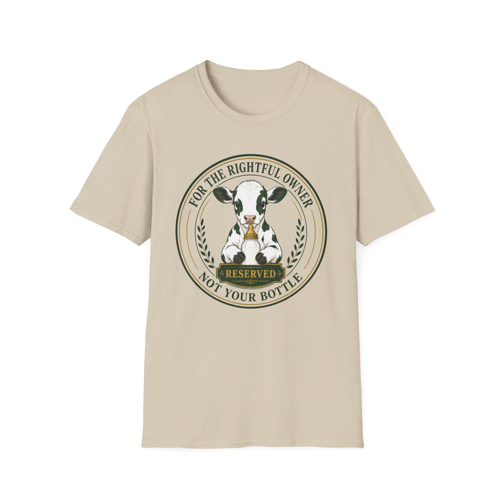 A beige short-sleeve crewneck t-shirt featuring a circular graphic print of a black and white cow inside a badge design with the text 'FOR THE RIGHTFUL OWNER' and 'NOT YOUR BOTTLE' and 'RESERVED'.