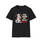 A black short-sleeve crewneck t-shirt featuring a graphic of a cartoon cow with crossed arms next to the text 'YOU DRINK MY MILK? WEIRD.' in cream and red lettering, shown on a plain white background.