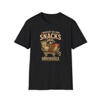 A black short-sleeve crewneck t-shirt featuring a vintage-style graphic of a raccoon holding a basket of snacks with the text 'I BROUGHT MY OWN SNACKS OBVIOUSLY.' printed on the front.