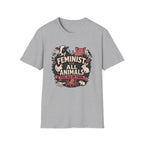 A light heather gray short-sleeve t-shirt with a central graphic print featuring the text 'FEMINIST FOR ALL ANIMALS' and 'YES, ALL OF THEM' surrounded by illustrated animals and flowers.