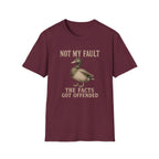 A maroon short-sleeve crewneck t-shirt featuring a graphic of a mallard duck with the text 'NOT MY FAULT THE FACTS GOT OFFENDED' printed in a beige serif font.