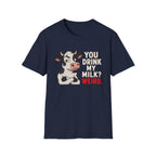 A navy blue short-sleeve crewneck t-shirt featuring a graphic of a cartoon cow next to the text 'YOU DRINK MY MILK? WEIRD.' in white and red lettering, displayed on a solid white background.