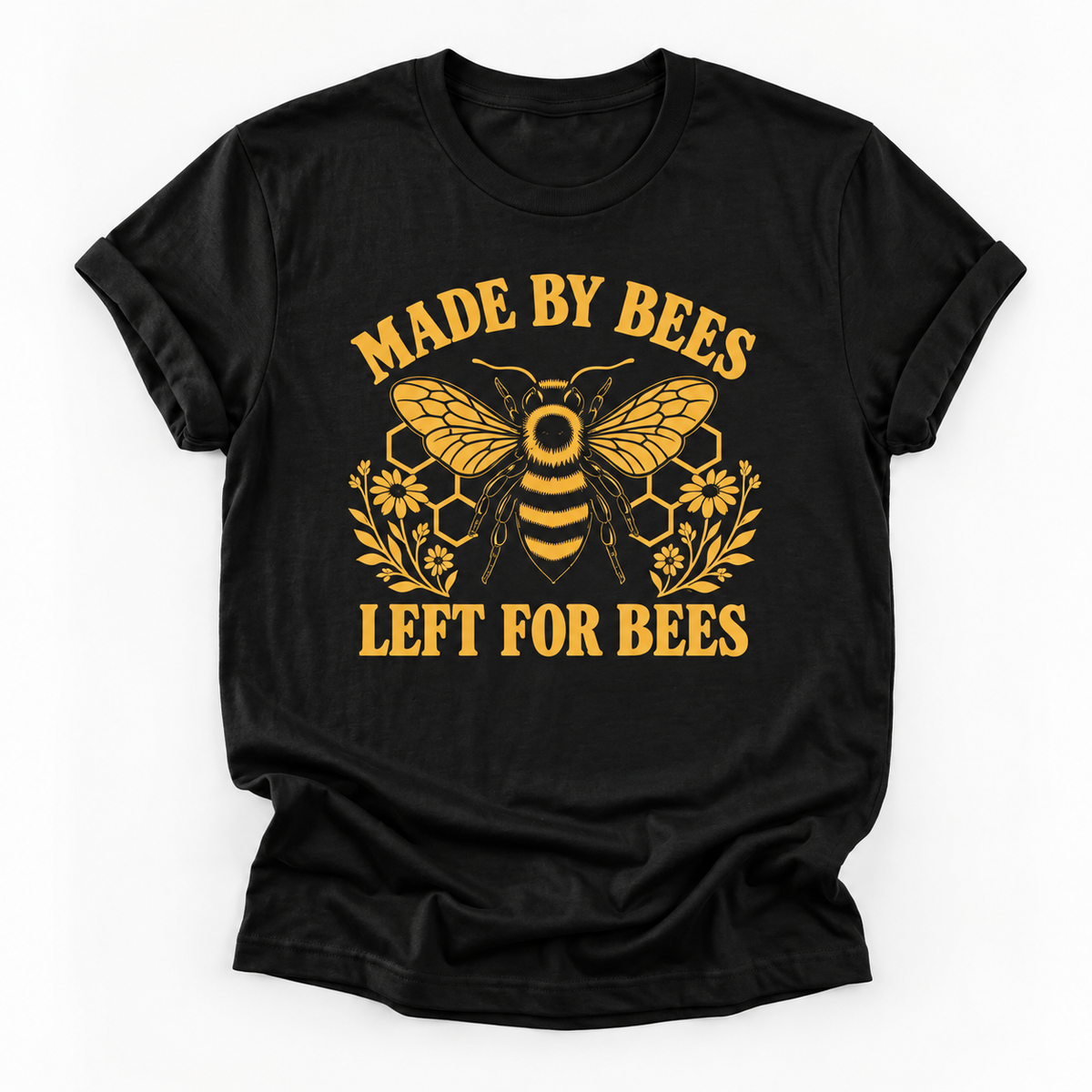 A black short-sleeve crewneck t-shirt with a yellow graphic print featuring a bee, honeycomb, flowers, and the text 'MADE BY BEES LEFT FOR BEES' on a white background.