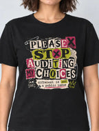 A woman wearing a black graphic t-shirt with the text 'PLEASE STOP AUDITING MY CHOICES' in a colorful, distressed collage style, paired with dark gray jeans, against a light gray background.