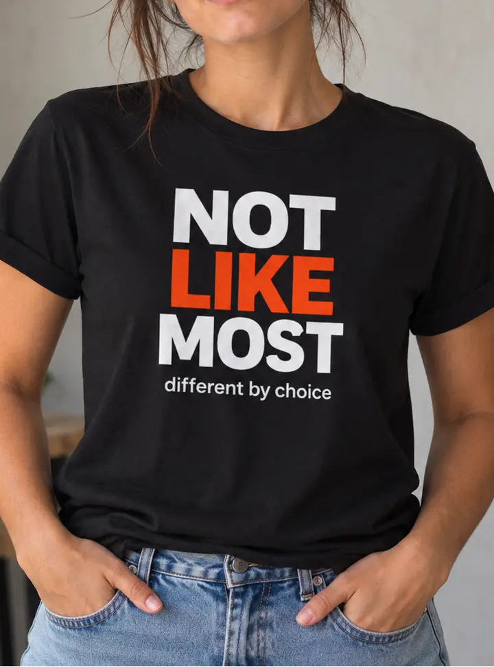 Woman wearing a black t-shirt with the text 'not like most different by choice'