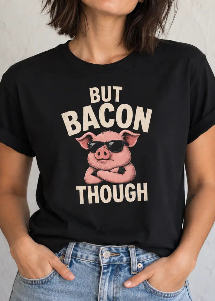 Woman wearing a black activist tee with a pig graphic and text 'but bacon though'