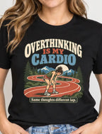 Woman wearing a black short sleeved t-shirt with a woman runner graphic and text 'overthinking is my cardio. Same thoughts, Different day'