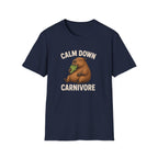Navy Blue vegan short-sleeve crewneck t-shirt featuring a cartoon graphic of a brown groundhog holding green lettuce, with the text 'CALM DOWN CARNIVORE' printed in beige above and below the illustration.