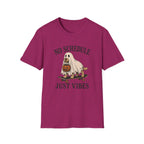 Pink t-shirt with dog on a skateboard halloween graphic and text 'no schedule just vibes'