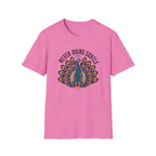 A pink short-sleeve crewneck t-shirt featuring a graphic of a peacock with its tail feathers spread, under the text 'NEVER DOING SUBTLE' 