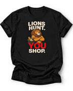 Lion holding a grocery basket with the slogan Lions Hunt You Shop on a black graphic T-shirt design.