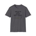 A dark gray crewneck t-shirt with a distressed graphic on the chest that reads 'SOME OF US WERE BUILT OFF-TRAIL' above a row of footprints and a small bootprint, shown on a plain white background.