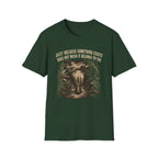 Dark Green t-shirt with an elephant graphic in the jungle and text 'just because something exists doesn't mean it belongs to you'