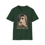 Forest Green short-sleeve t-shirt with a vintage-style Halloween graphic of a ghostly figure in a sheet next to a jack-o'-lantern, with the text 'CREEPY BUT KIND' printed below.