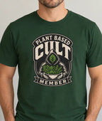 Man wearing a forest green tee with a graphic image and text 'plant based cult member'