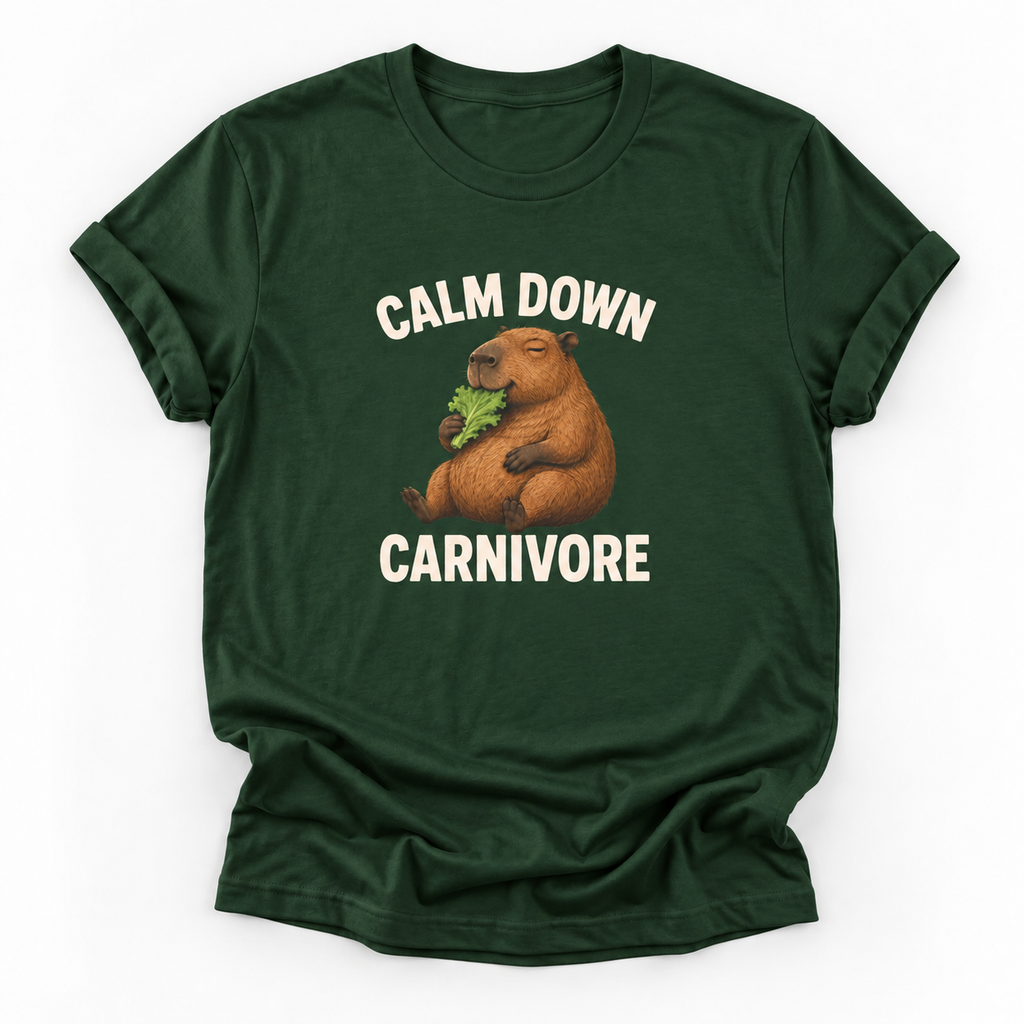 A dark green short-sleeve t-shirt with a graphic of a capybara eating leafy greens, surrounded by the text 'CALM DOWN CARNIVORE' in white. The t-shirt is displayed flat against a clean white background.