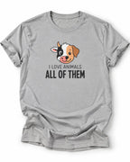 A sports grey vegan short-sleeve crewneck t-shirt featuring a cartoon dog graphic and the text 'I LOVE ANIMALS ALL OF THEM' printed on the chest, displayed against a solid white background.