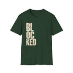 A green short-sleeve crewneck t-shirt featuring the word 'BLOCKED' printed vertically on the front in a distressed beige font, shown against a plain white background.