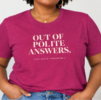 A woman wearing a heathered magenta t-shirt with the text 'OUT OF POLITE ANSWERS. (TRY AGAIN TOMORROW)' printed in white on the front, paired with blue jeans.