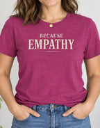 woman wearing a pink tshirt with text 'because empathy'