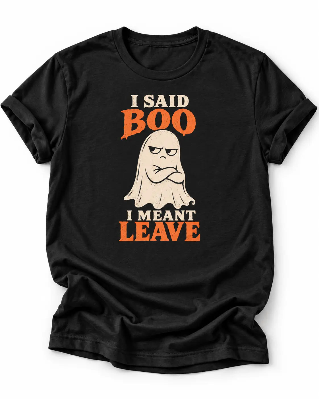 Black graphic T-shirt featuring a grumpy cream ghost with crossed arms and the words “I Said Boo I Meant Leave” in cream and orange lettering.