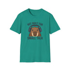 Jade green  t-shirt with image of a capybara wearing headphones and text 'not built for small talk'