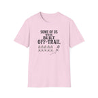 A light pink short-sleeve crewneck t-shirt with a black graphic print on the front that reads 'SOME OF US WERE BUILT OFF-TRAIL' above a row of boot prints and a trail graphic.