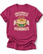 Hot pink graphic t-shirt with an image of a tub of hummus and text 'emotionally supported by hummus' 