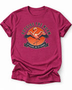 Heather magenta graphic t-shirt with a flamingo design and the text 'OUTSIDE THE NORM BY DESIGN, NOT BY CHANCE', 