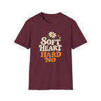 A maroon short-sleeve crewneck t-shirt featuring a retro-style graphic on the chest that reads 'SOFT HEART HARD NO' in cream and orange lettering, decorated with a small daisy and butterfly illustration, shown against a plain white background.