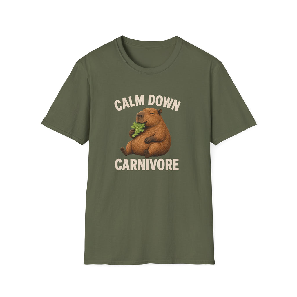 An olive green short-sleeve t-shirt with a graphic of a brown capybara holding green leaves, with the text 'CALM DOWN CARNIVORE' in beige above and below the illustration, displayed on a solid white background.