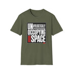 A military green short-sleeve crewneck t-shirt with a graphic print on the front reading 'UNAPOLOGETICALLY OCCUPYING SPACE' in white and black, with red accent bars, shown on a plain white background.